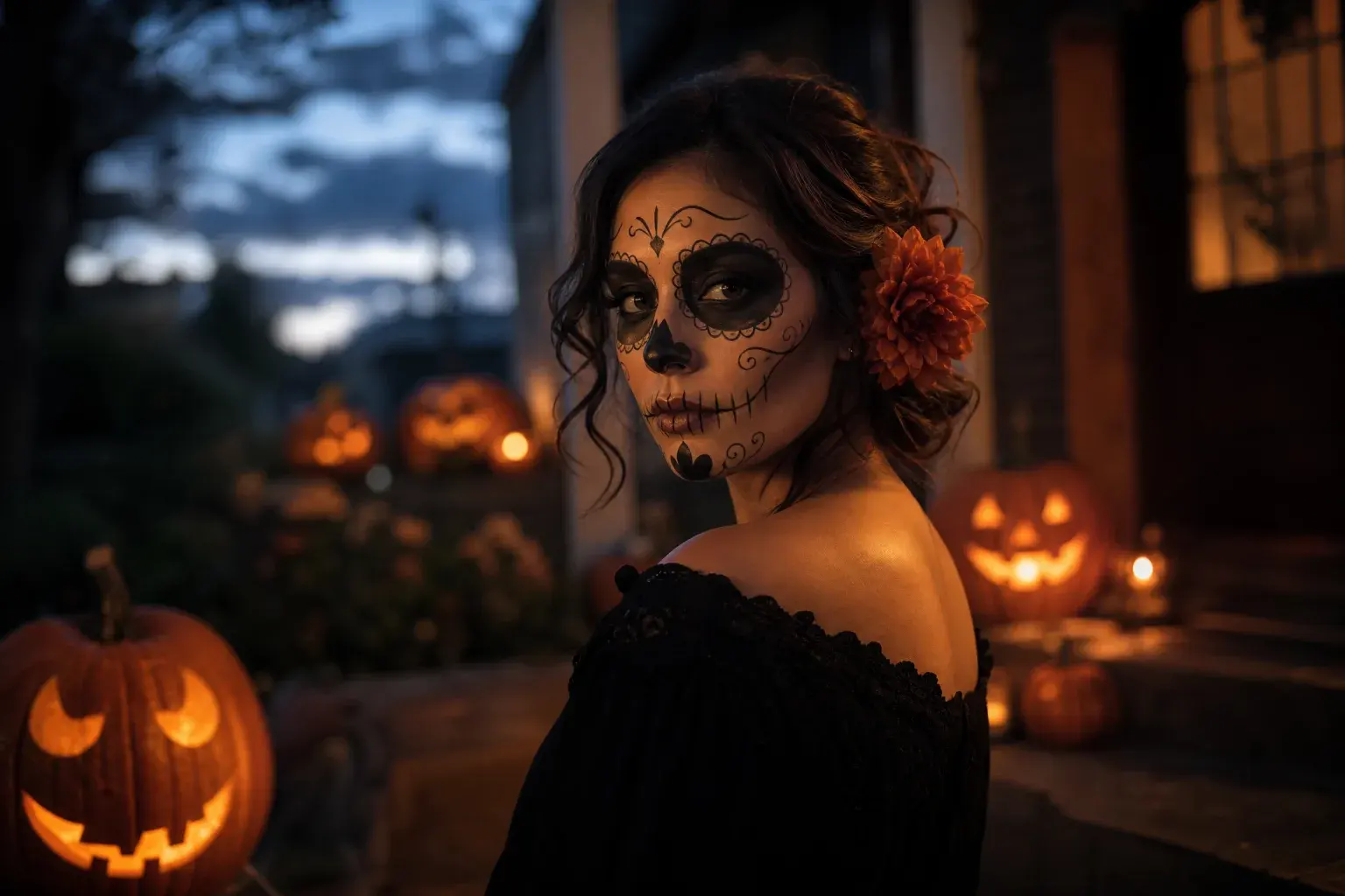 Halloween portrait with tasteful sugar-skull inspired makeup among carved pumpkins on a porch at dusk.